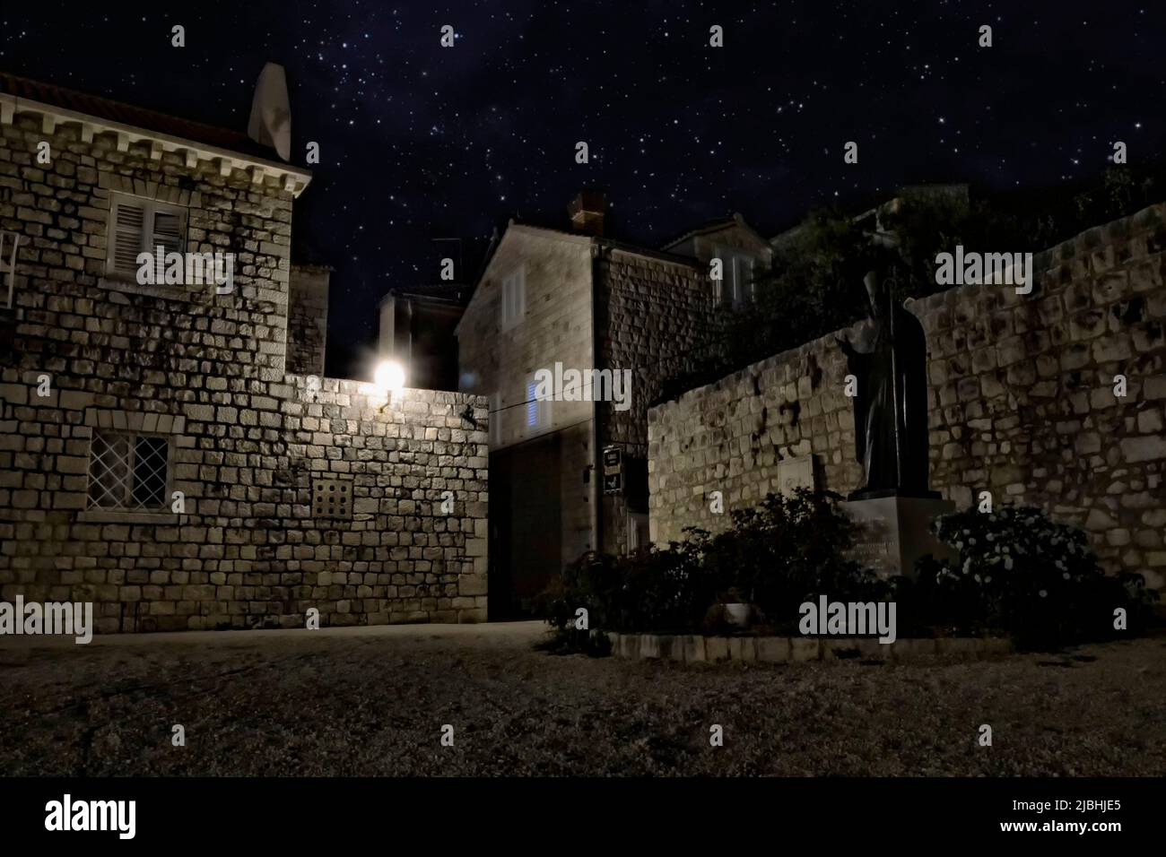 Stone house in the Croatian town of Trogir. Lamps and stars shine beautifully. Stock Photo