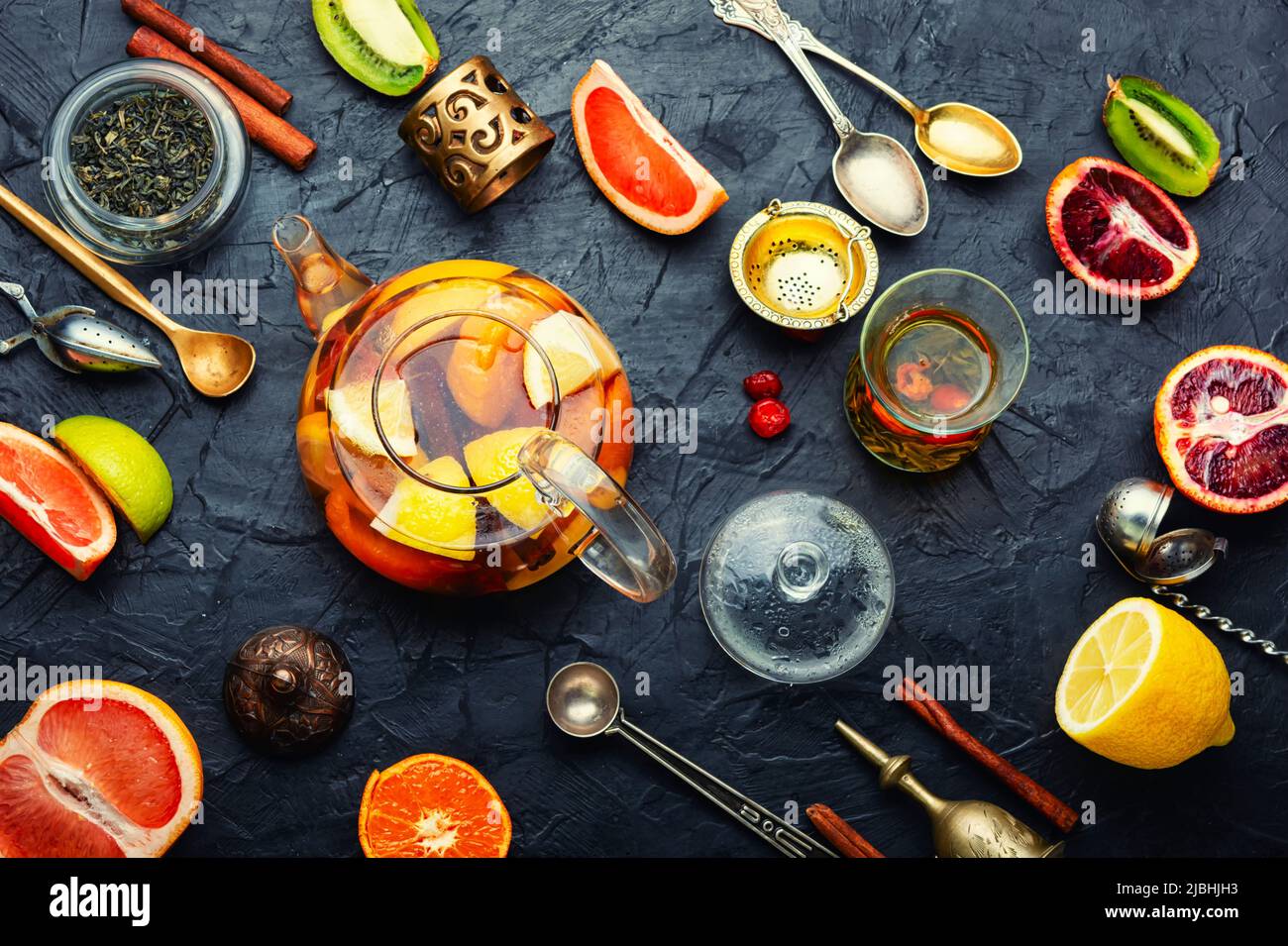 Moroccan tea, tea kettle with grapefruit, orange, lime and mandarin
