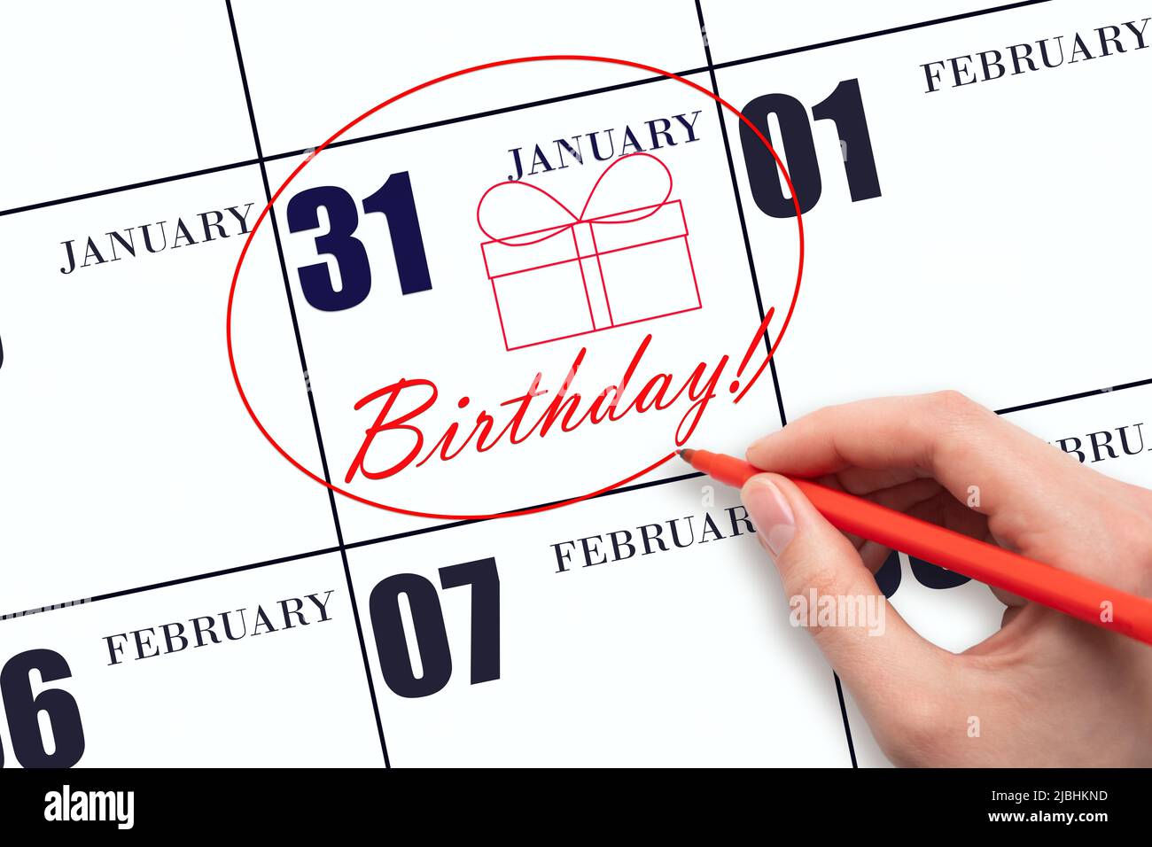 31st-day-of-january-the-hand-circles-the-date-on-the-calendar-31-january-draws-a-gift-box-and-writes-the-text-birthday-holiday-winter-month-day-o-stock-photo-alamy