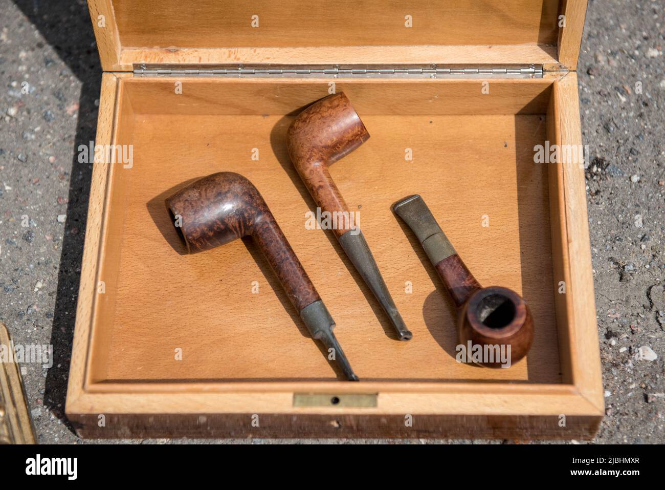 Retro vintage Smoking pipes in a wooden box Stock Photo