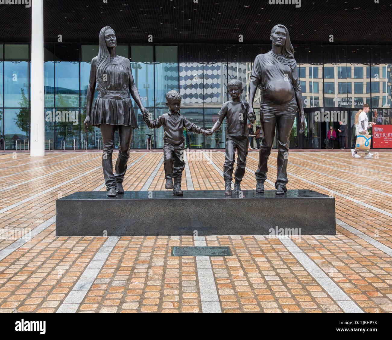 A Real Birmingham family is a bronze statue by artist Gillian Wearing. It conveys the idea that what constitutes a family isn't fixed. Stock Photo