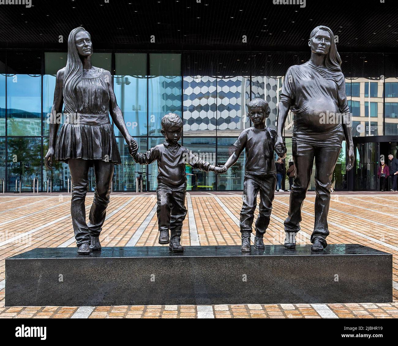 A Real Birmingham family is a bronze statue by artist Gillian Wearing. It conveys the idea that what constitutes a family isn't fixed. Stock Photo