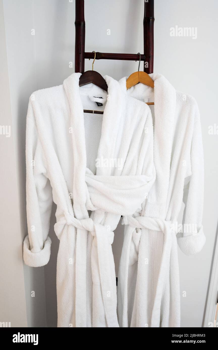 Two bathrobes at a hotel room bathroom Stock Photo Alamy