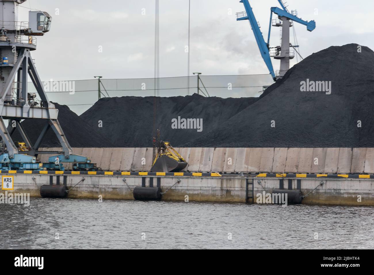 Loading and unloading of coal, railway freight cars, railway Cargo terminal, cranes. Sea cargo