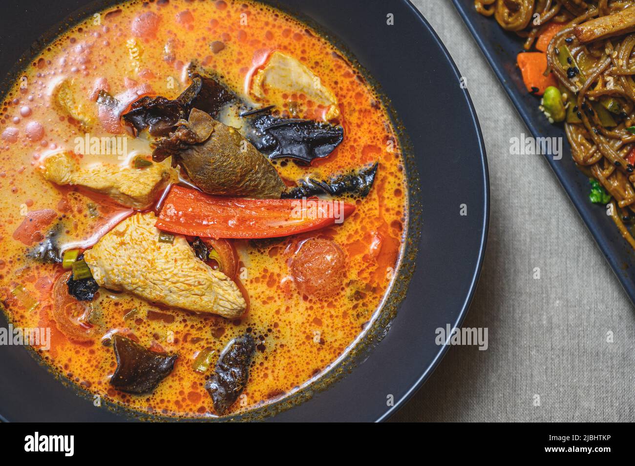 Massaman curry with pork. Red curry with meat and vegetables. Thai traditional food. Stock Photo
