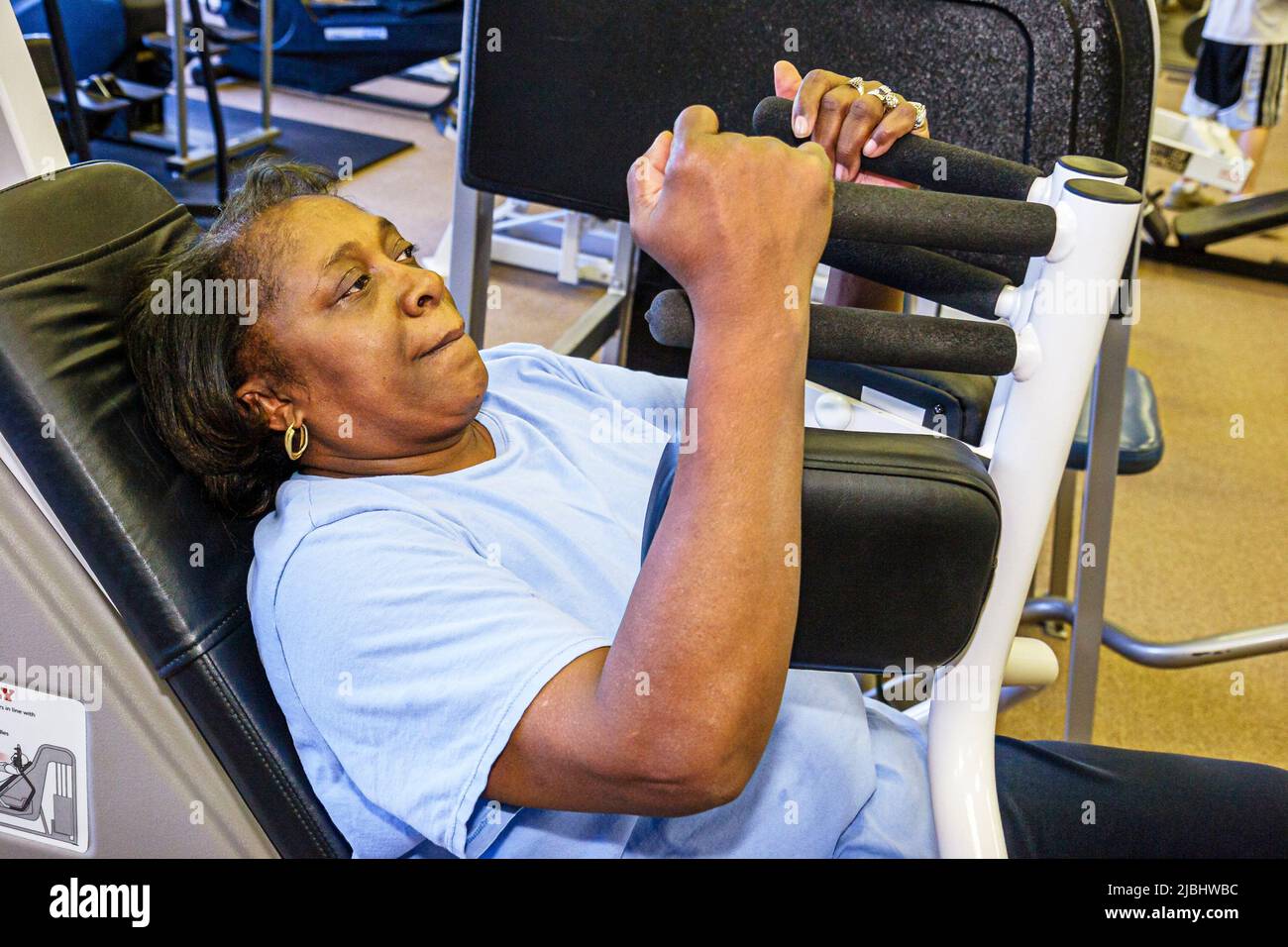 Monroeville Alabama,YMCA,exercise room,workout equipment working out exercising,Black adult woman female lady making effort Stock Photo