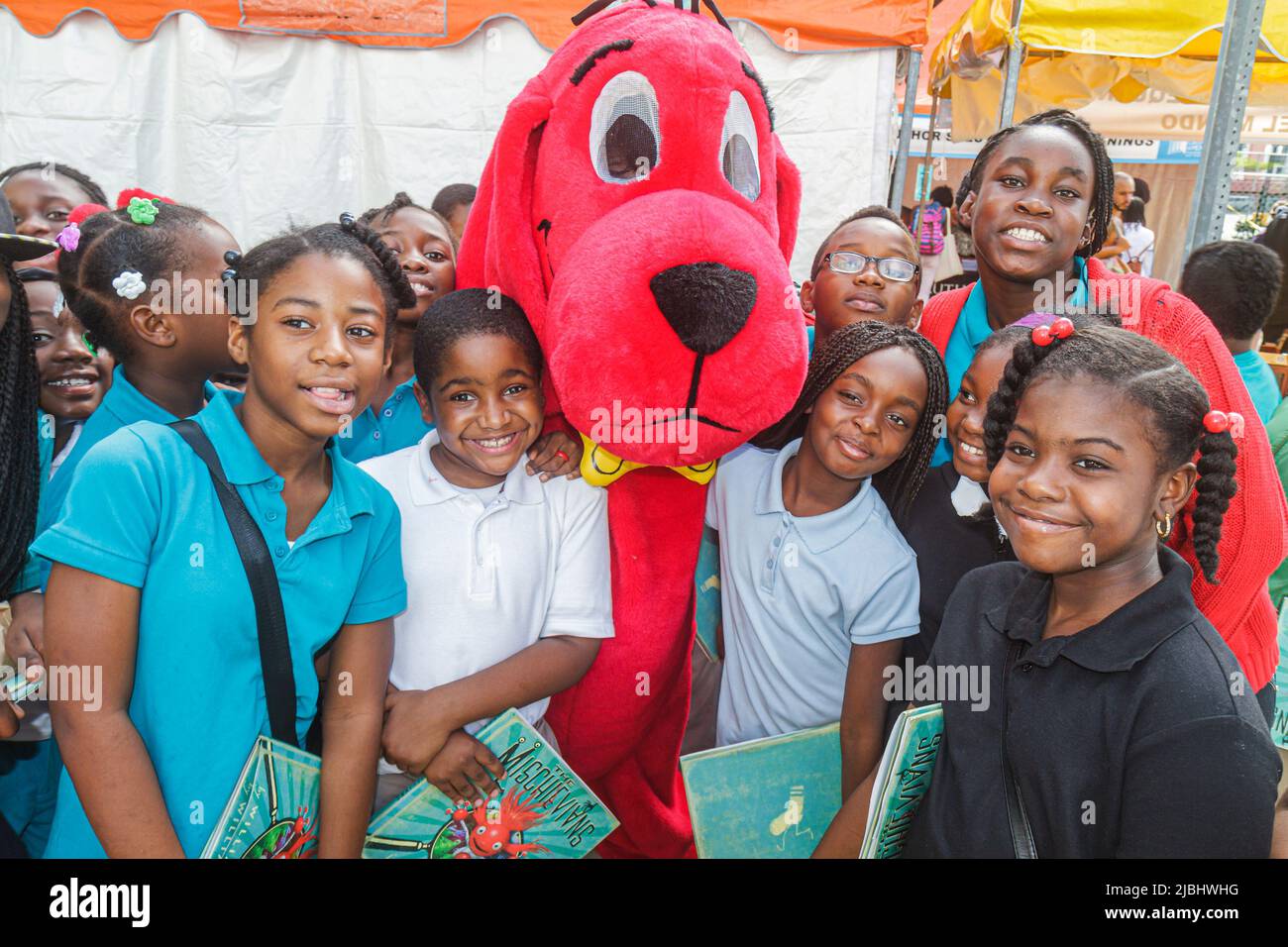 Deborah Forte, President of Scholastic Entertainment is joined by their  most famous book characther Clifford The Big Red Dog and children attending  the 2/14/05 ceremonial NASDAQ opening bell ring for trading in