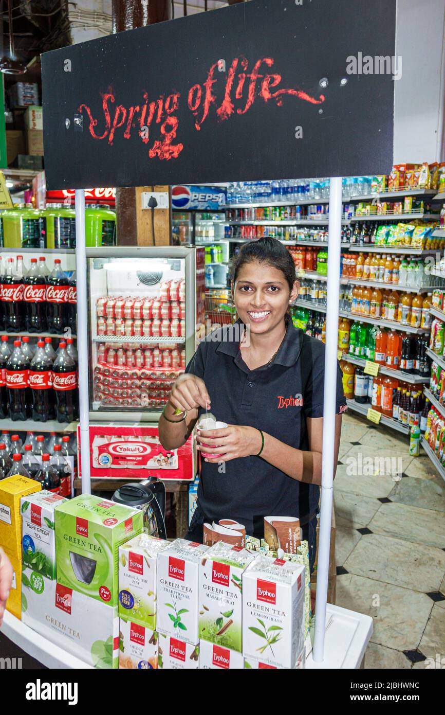 Mumbai India,Colaba Bhandar,Sahakari,grocery store supermarket interior inside market,display sale Typhoo Green Tea woman female offering free sample Stock Photo