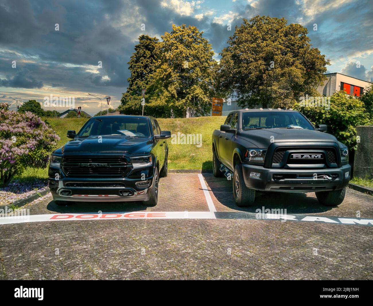 Gummersbach, Germany - June 13, 2021: Two Dodge Ram pickup trucks are for sale at a car dealership in Gummersbach. Stock Photo