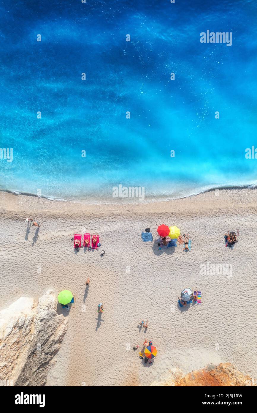 Aerial view of adriatic sea, waves, sandy beach and umbrellas Stock Photo
