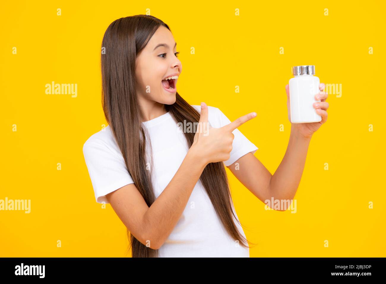 Teen girl with natural food additives or vitamin pills, healthy ...