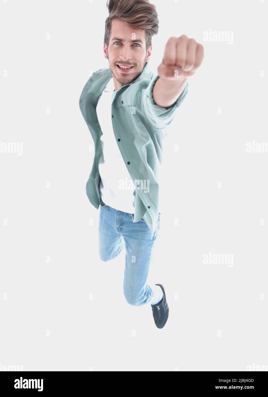 Handsome man jumping with vigor on white background Stock Photo - Alamy