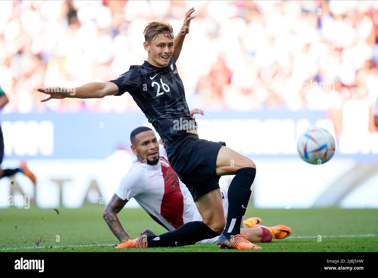 Niko Kirwan of New Zealand and Alexander Callens of Peru during the friendly match between Peru and New Zealand played at RCDE Stadium on June 5, 2022 in Barcelona, Spain. (Photo by Bagu Blanco / PRESSINPHOTO) Stock Photo