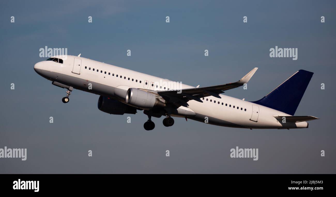 Airplane takes off from airport Stock Photo - Alamy