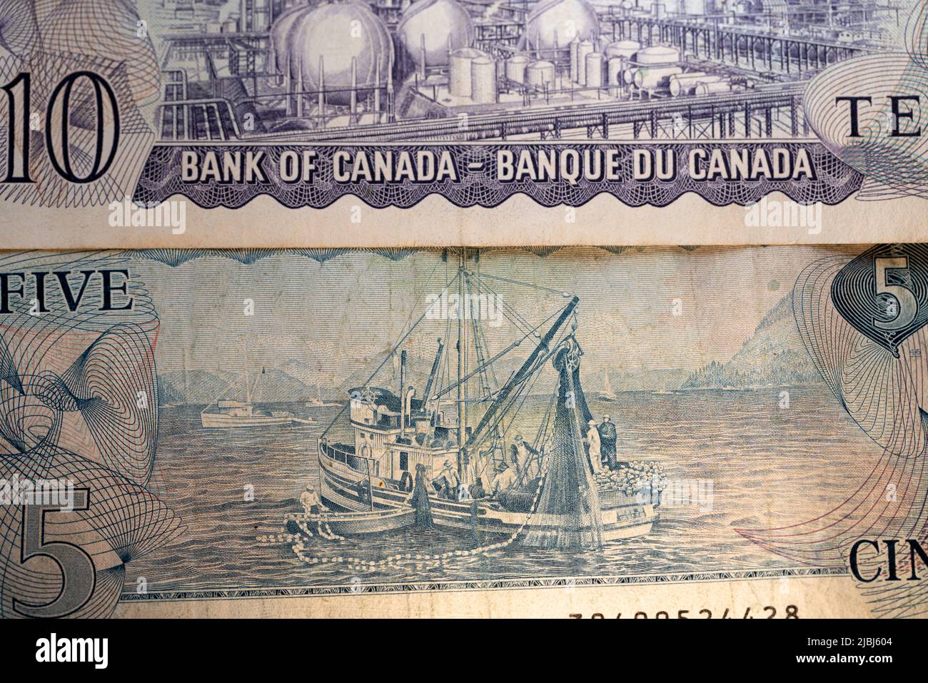 Toronto, Canada - October 30. 2021: Fishing Industry in Canada depicted on the backside of the five Canadian Dollar banknote from 1972 Stock Photo