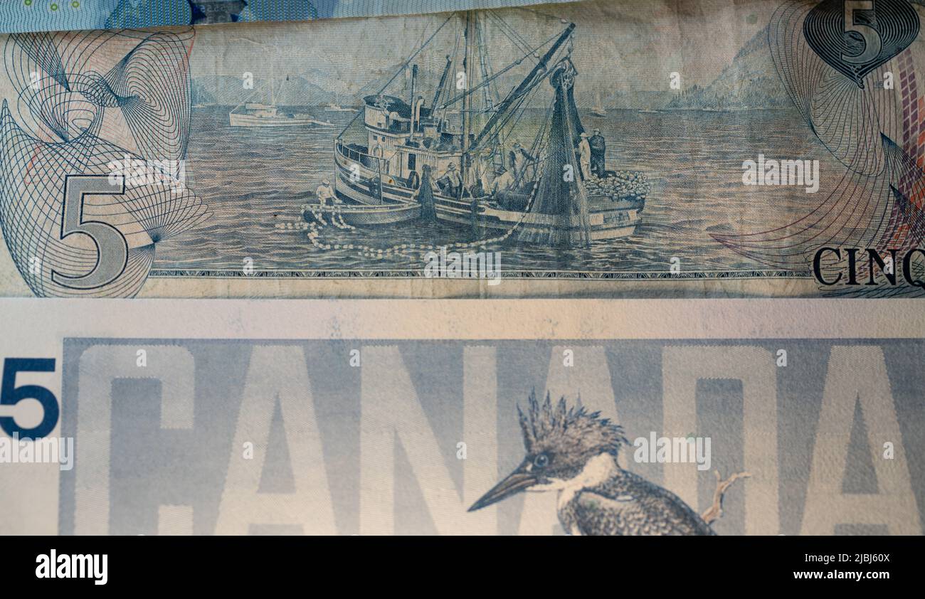 Toronto, Canada - October 30. 2021: Fishing Industry in Canada depicted on the backside of the five Canadian Dollar banknote from 1972. Birds of Canad Stock Photo