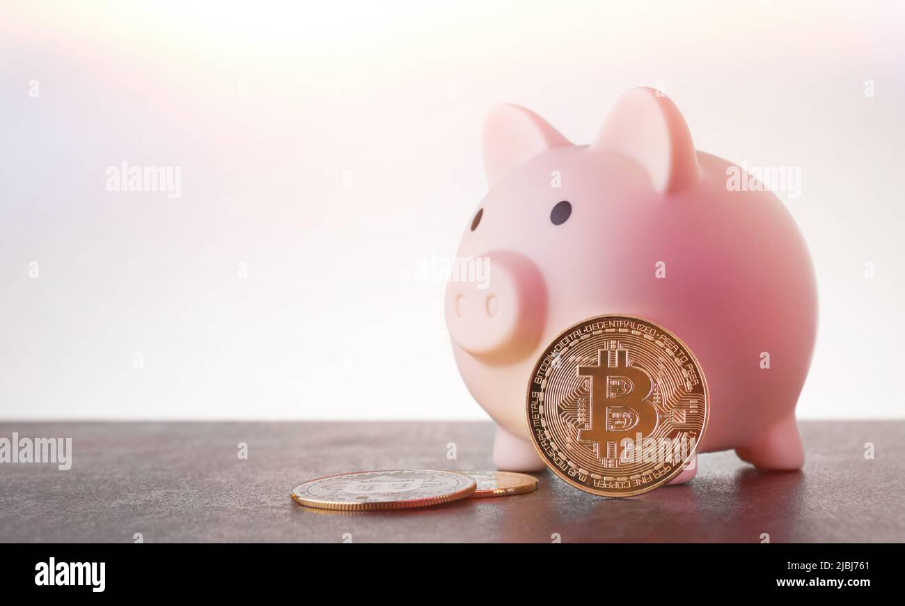 Piggy bank for bitcoin coins. Cryptocurrency bank. Accumulation of virtual  money. Buying and selling virtual money on the stock exchange Stock Photo -  Alamy