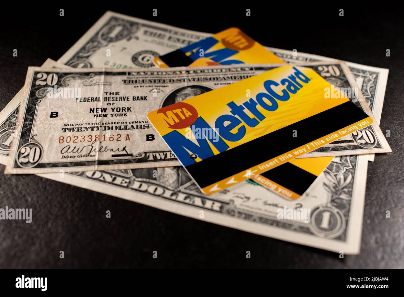 Manhattan, New York/USA - March 26. 2021: Metrocard on old twenty dollar banknote from New York Federal Reserve. NYC Metro Card used on MTA Subway and Stock Photo