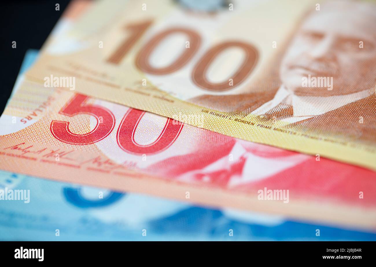 Manhattan, New York/USA - April 8. 2021: Canadian dollar banknotes five, fifty and one hundred canadian dollar bills Stock Photo