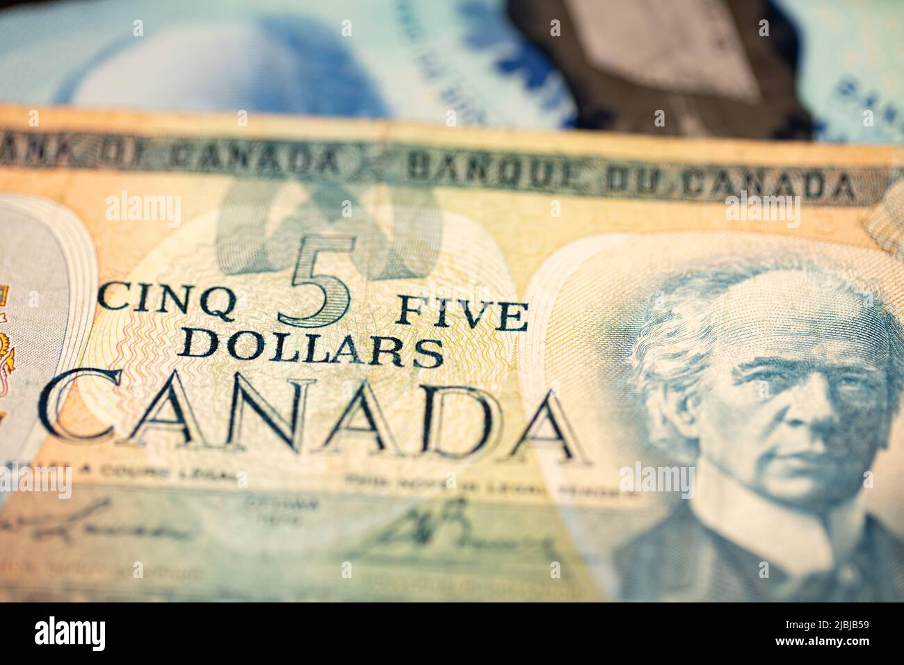 Manhattan, New York/USA - April 8. 2021: Old and new canadian dollar banknote. Five canadian dollar bill Stock Photo