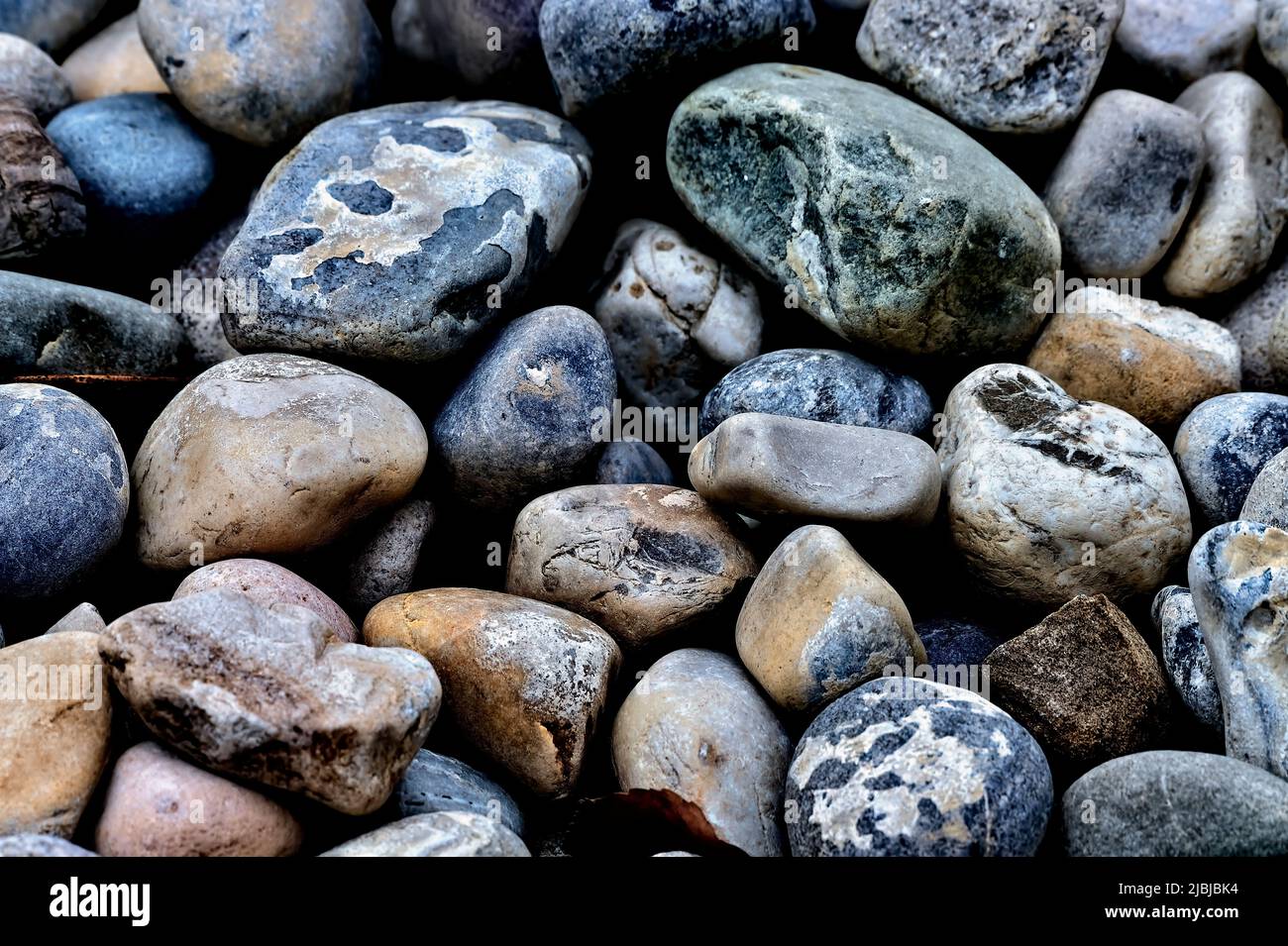 A close up image of a pile of colorful beach stones Stock Photo
