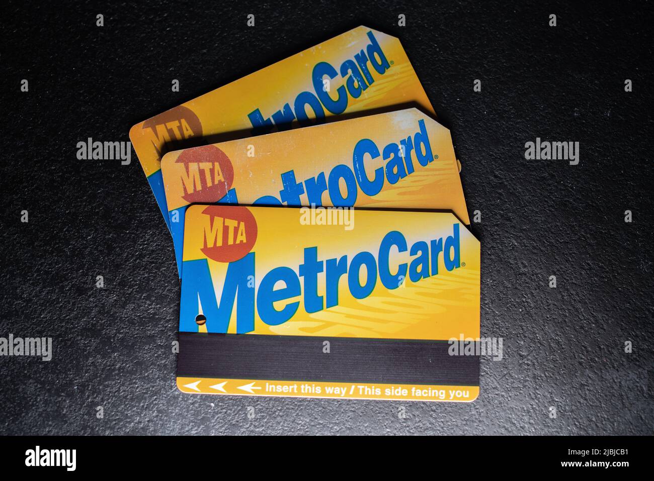 Manhattan, New York/USA - March 26. 2021: MTA Metro Card on dark background, ticket to use public transport in New York City. Stock Photo