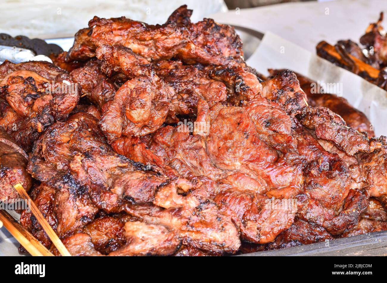 Grilled Pork on sell in market Stock Photo