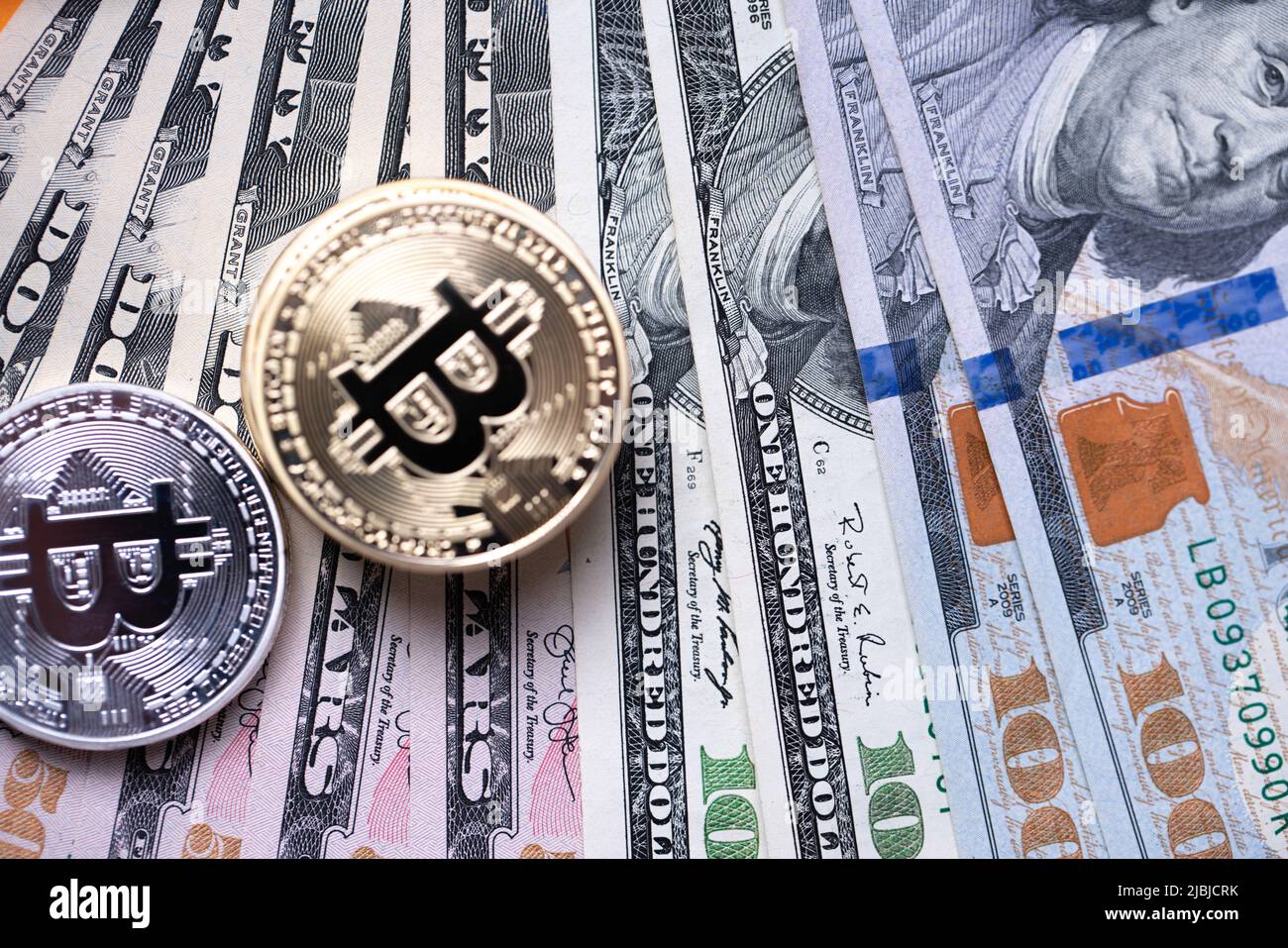 Piled up bitcoin coins on top of US dollar banknotes. Gold and silver BTC  coins. Crypto exchange to US dollar concept. Digital crypto currency with pa  Stock Photo - Alamy