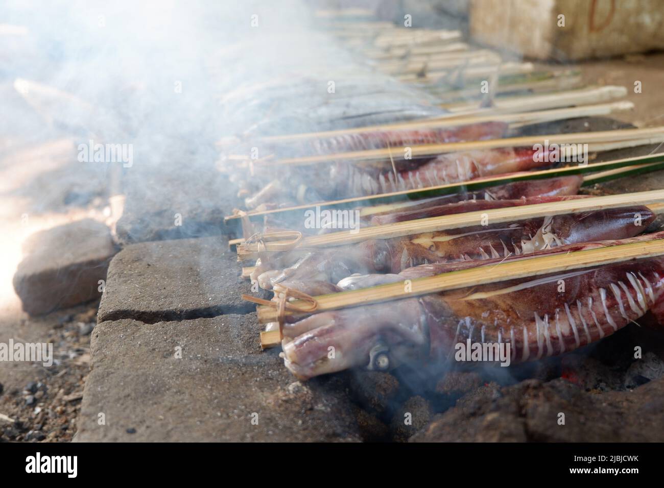 smoked squid is a delicacy. Smoking is a traditional way of preserving food. Stock Photo