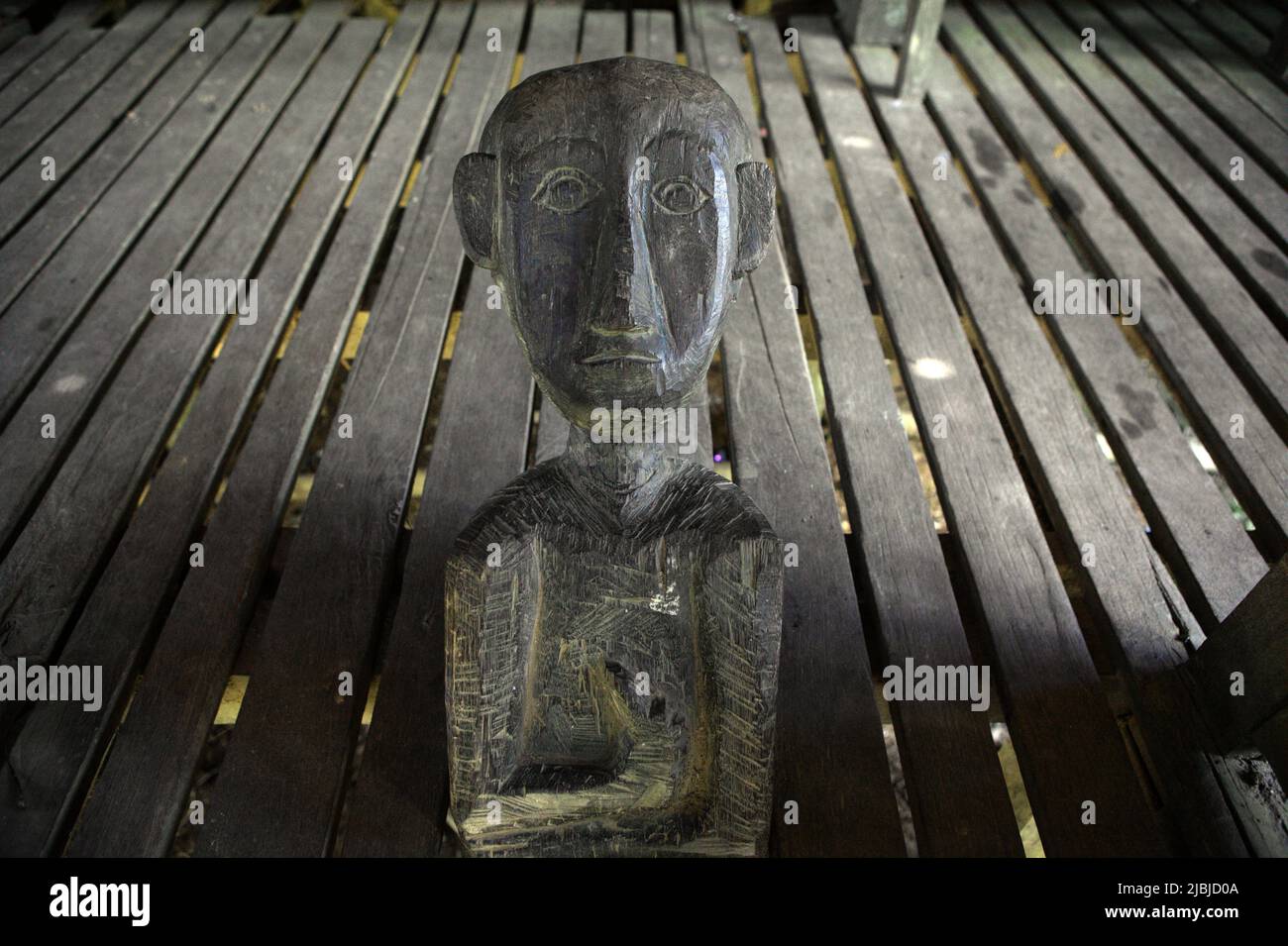 Human-shaped sculpture, a stairway sculpture, at Bali Gundi longhouse of traditional Dayak Taman community in Sibau Hulu, Putussibau Utara, Kapuas Hulu, West Kalimantan, Indonesia. Stock Photo