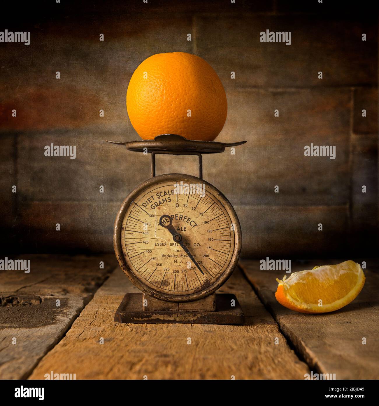 Orange with smal antique scale still life photography Stock Photo
