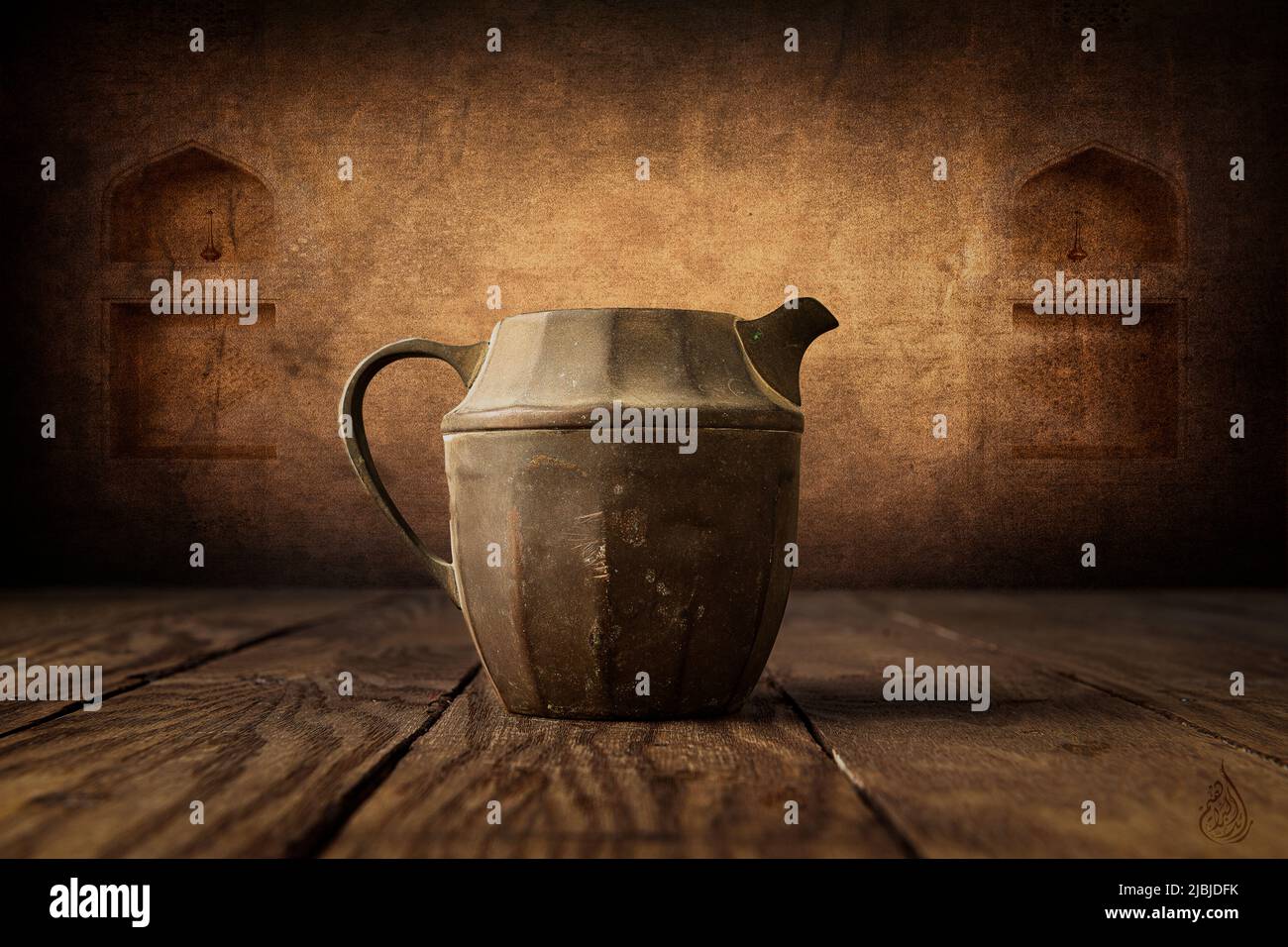 Old small arabic vintage pot on top of old table with old bulding background Stock Photo