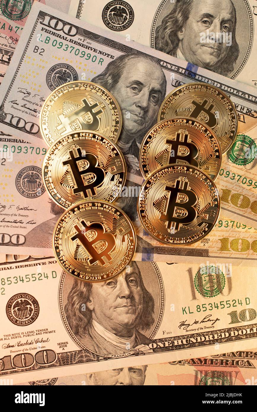 Bitcoin on dollar banknotes. One hundred dollar bills. Crypto currency  coins in Gold symbol for Digital money and Block chain technology Stock  Photo - Alamy