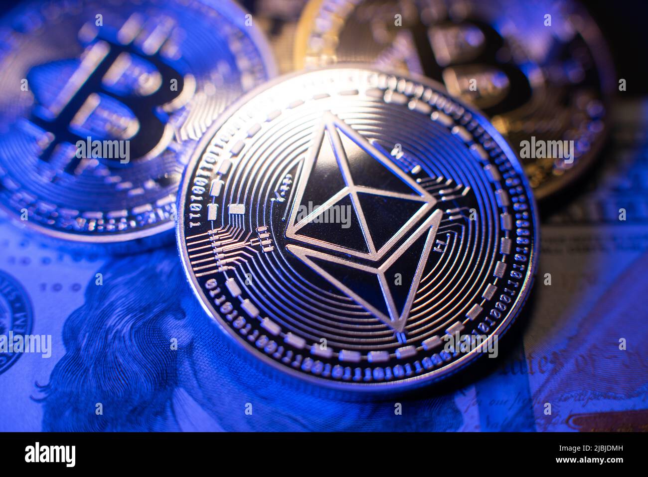 Ethereum on one hundred dollar banknote. Silver coin with Ethereum icon.  Digital crypto currency technology. Bitcoins in the background in silver  and Stock Photo - Alamy