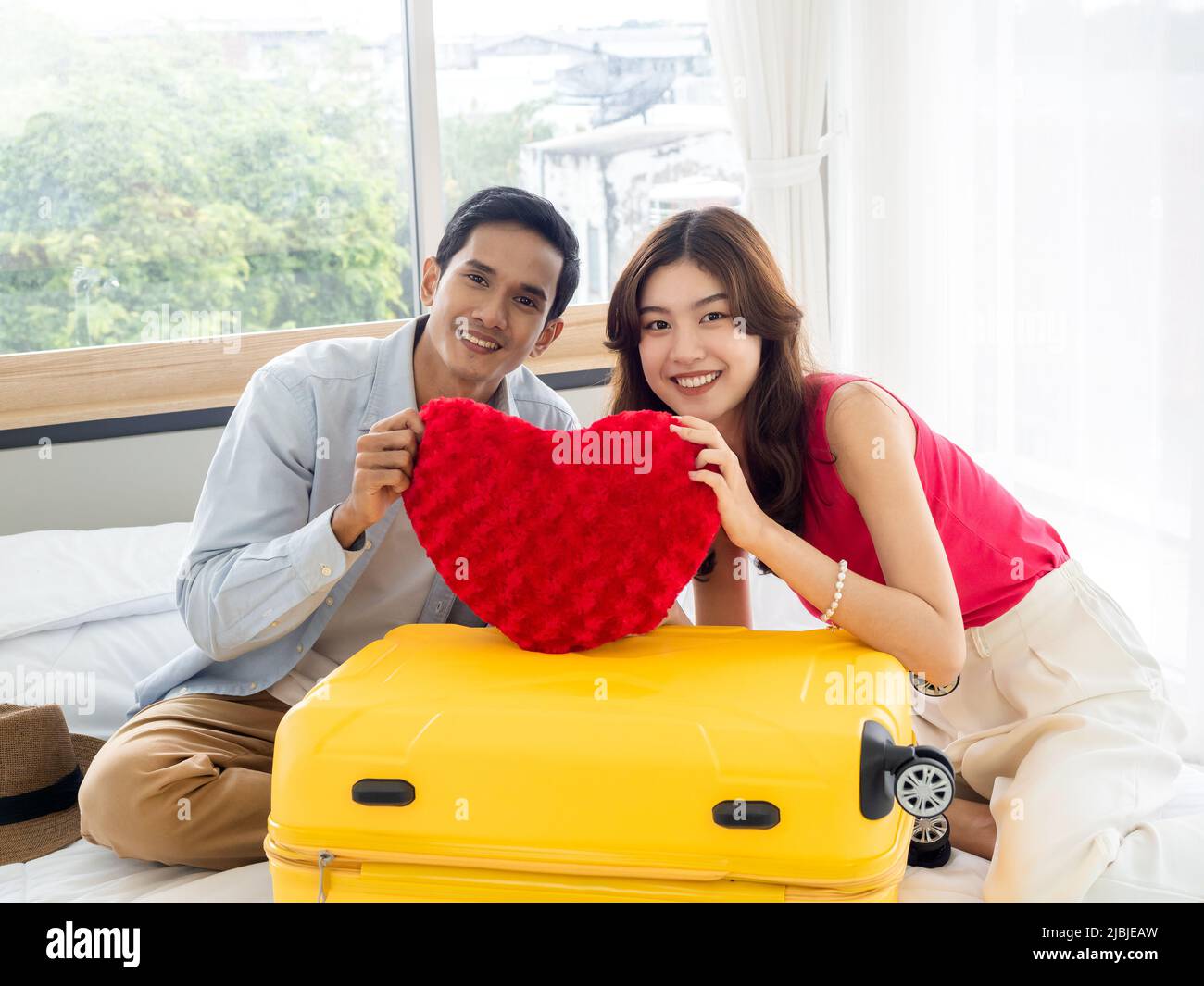 Red suitcase asian hi-res stock photography and images - Alamy