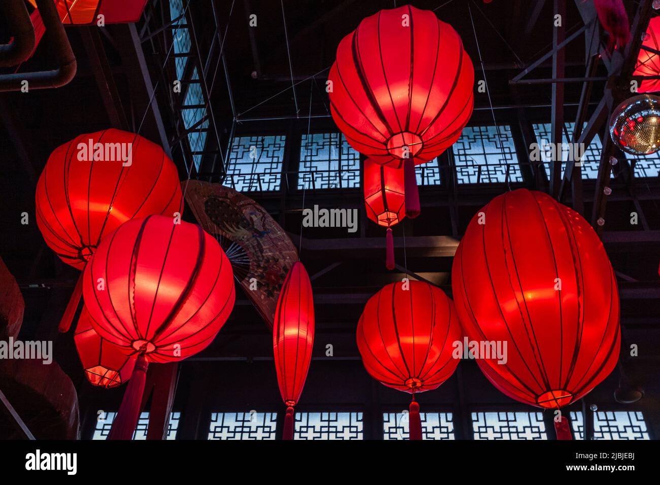 Chinese red lanterns glowing in hi-res stock photography and images - Alamy