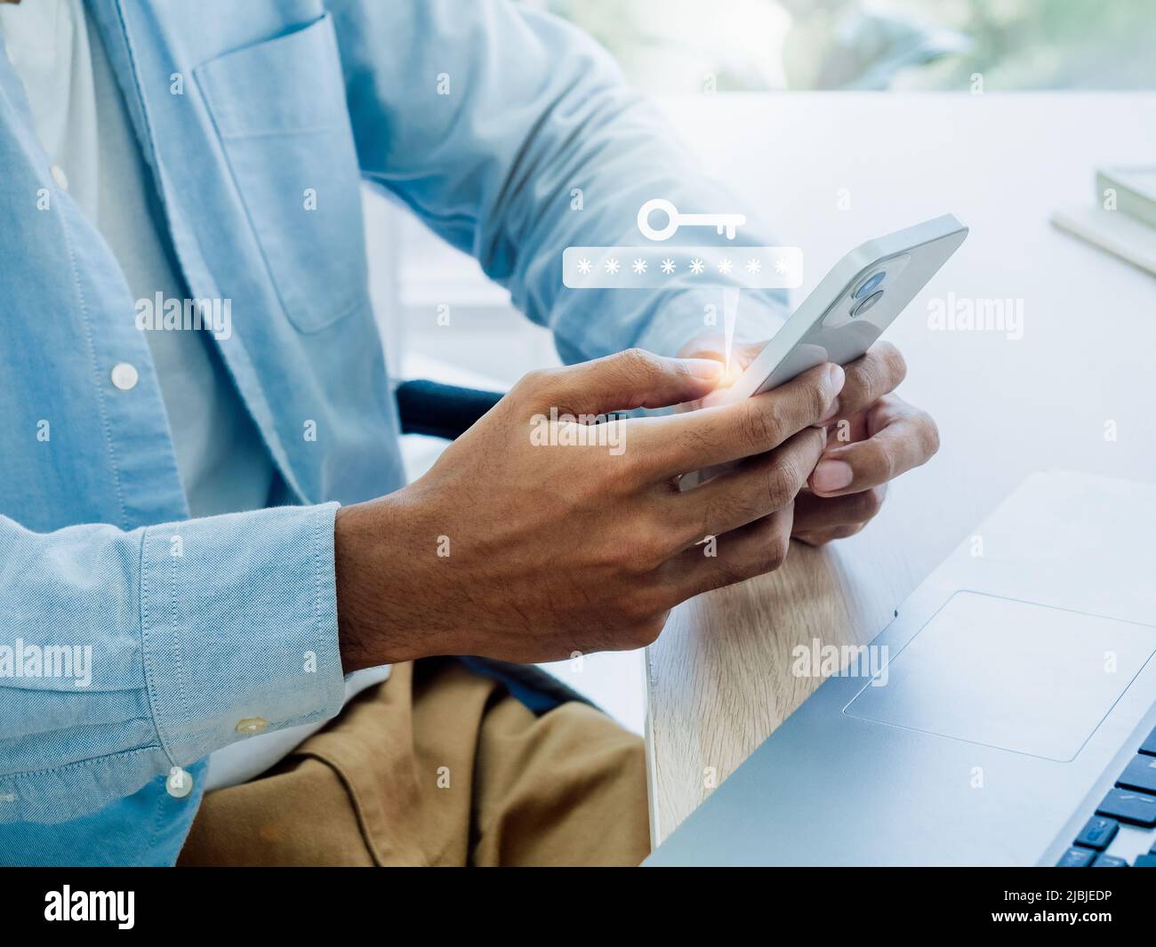 Two factor authentication or 2FA concept. Virtual key icon while access on phone with laptop for validate password, Identity verification, cybersecuri Stock Photo