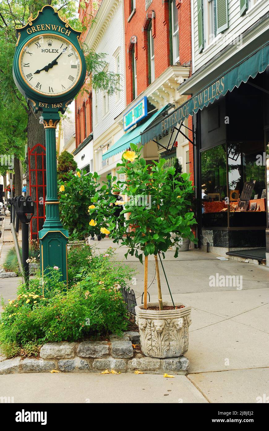 A large clock stands in front of a jewelry store in downtown Greenwich