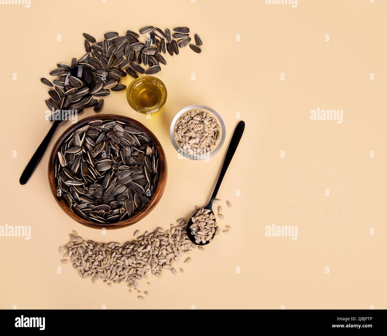 Sunflower oil and sunflower seeds on colourfull background. Organic