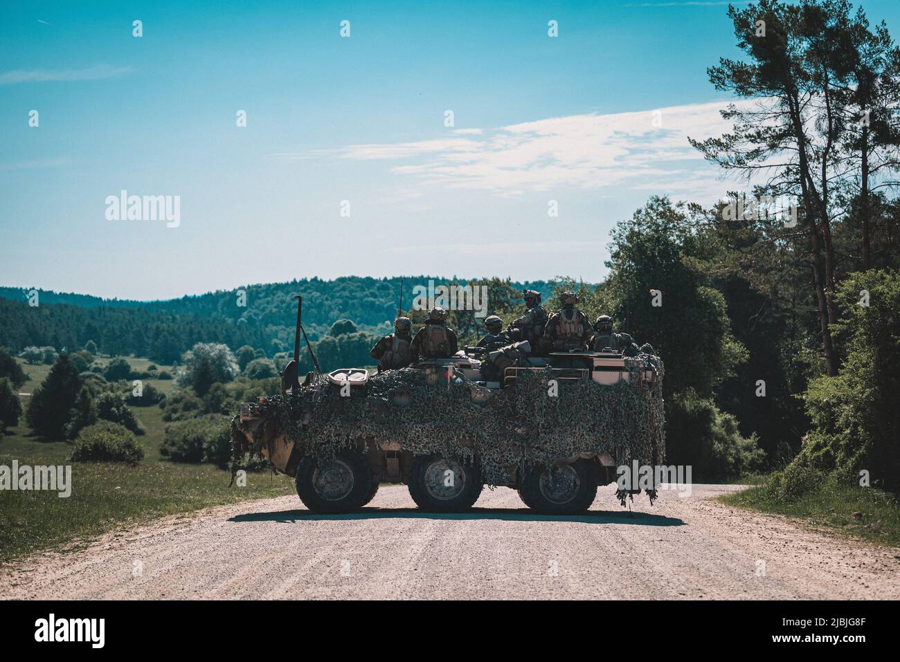 Belgian Armed Forces soldiers assigned to ISTAR COY observe the opposing forces from their Pandur Armored Personnel Carrier during Exercise Combined Resolve 17 (CbR 17) at the Joint Multinational Readiness Center in Hohenfels, Germany, on June 3, 2022. CbR 17 is a U.S. Army exercise consisting of 5,600 service members, NATO Allies, and partners from over 10 countries, and is designed to assess units' abilities to conduct operations in a multi-domain battle space. (U.S. Army photo by Staff Sgt. Dana Clarke) Stock Photo