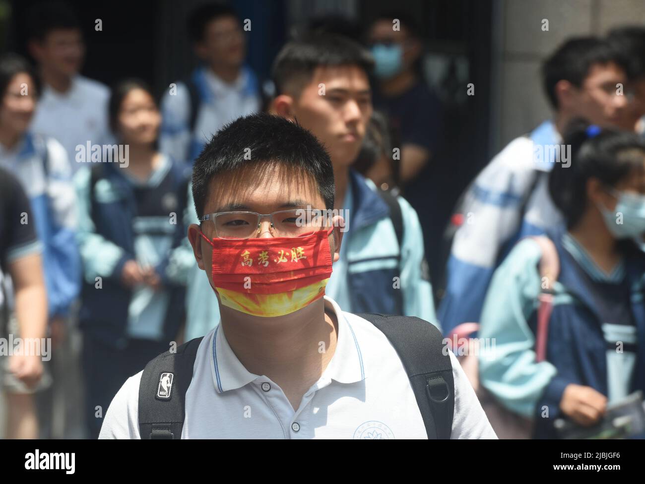 HANGZHOU, CHINA - JUNE 7, 2022 - Students walk out of hangzhou No. 14 Middle School after finishing the first Chinese test of the 2022 national colleg Stock Photo