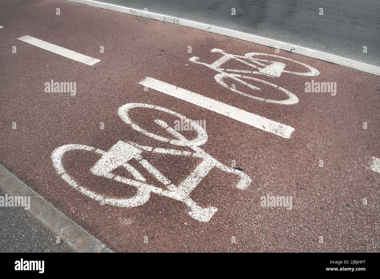 Alternate direction bike lane sign Stock Photo Alamy
