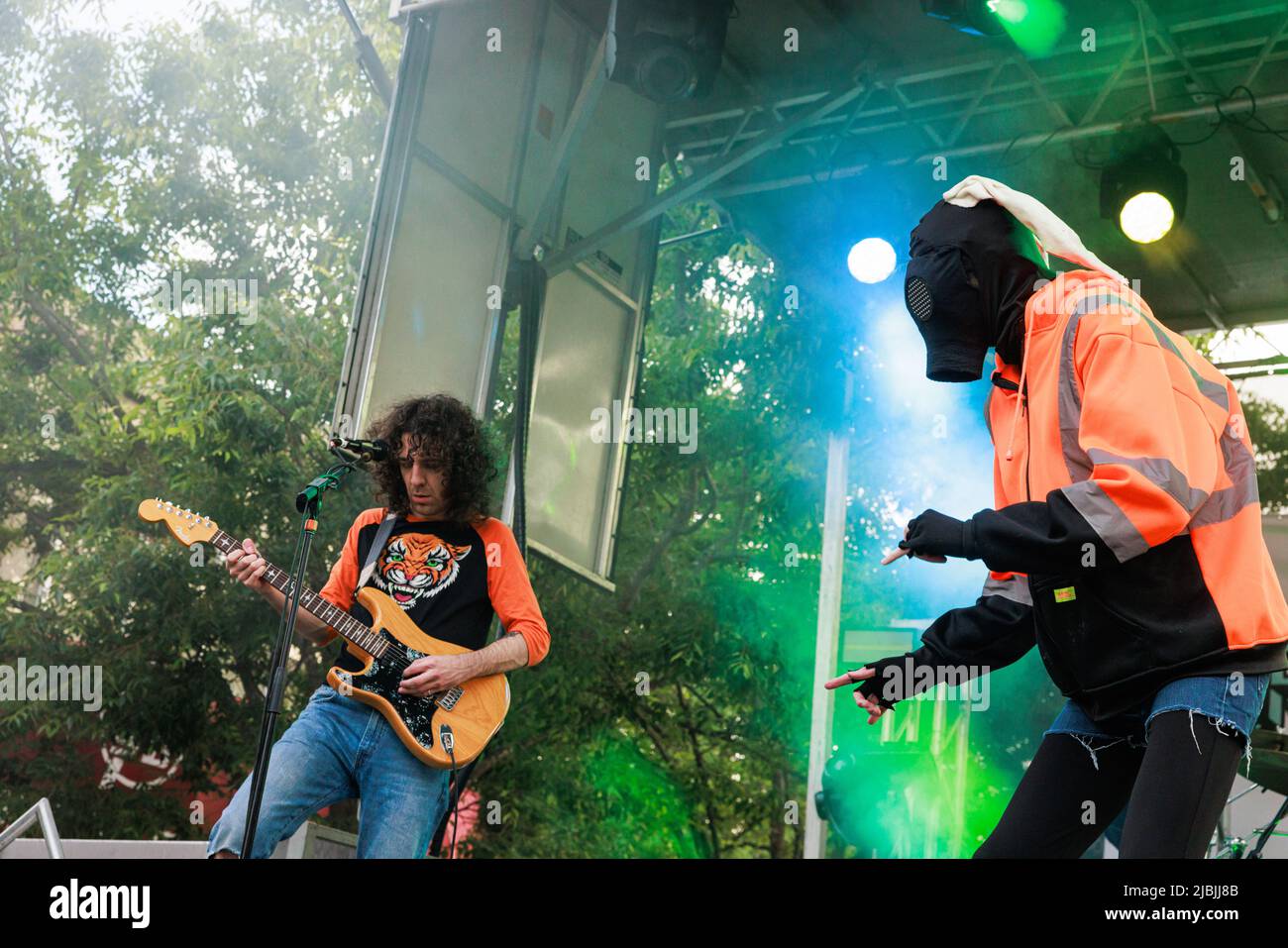 Bloomington, United States. 04th June, 2022. Will Toledo (R) of Car Seat Headrest, right, wears a mask, Ethan Ives plays guitar, while performing during the Granfalloon festival. Granfalloon is an annual festival of arts, music, and scholarship inspired by Hoosier author Kurt Vonnegut, according to the events webpage. The festival takes place in Bloomington, Indiana. Credit: SOPA Images Limited/Alamy Live News Stock Photo