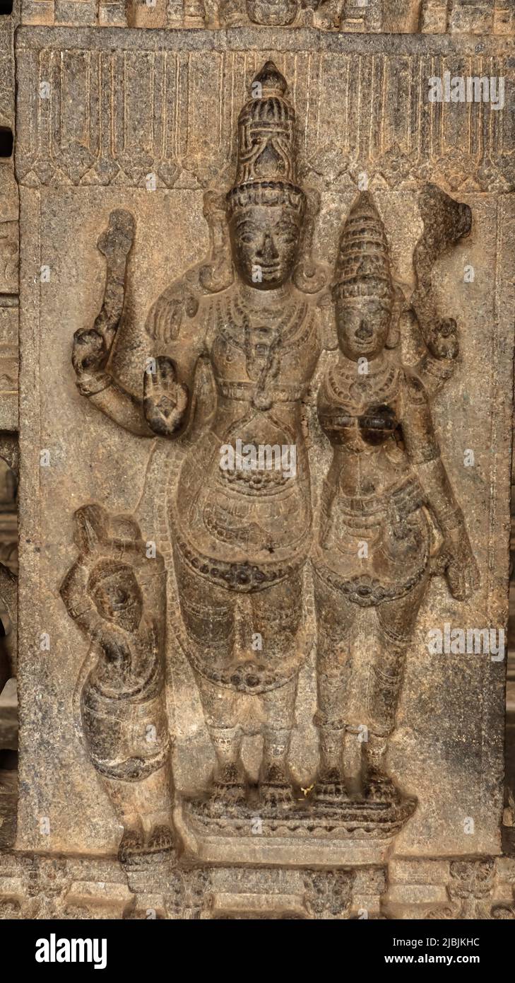 Carving Sculpture of Lord Vishnu and Lakshmi with Blessing Hand, Vellore Fort Temple, Vellore, Tamilnadu, India. Stock Photo