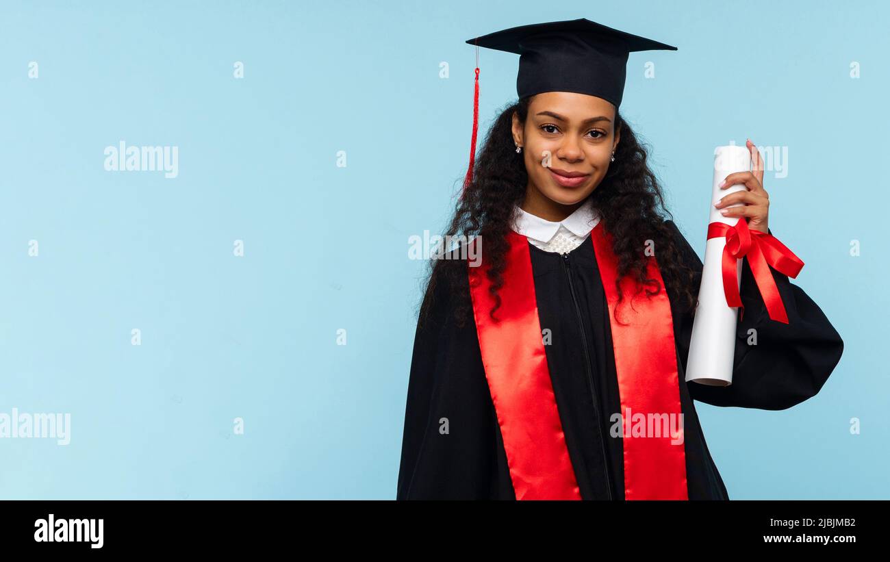 Happy Afro American Woman Graduate Wearing Ceremony Robe and Graduation