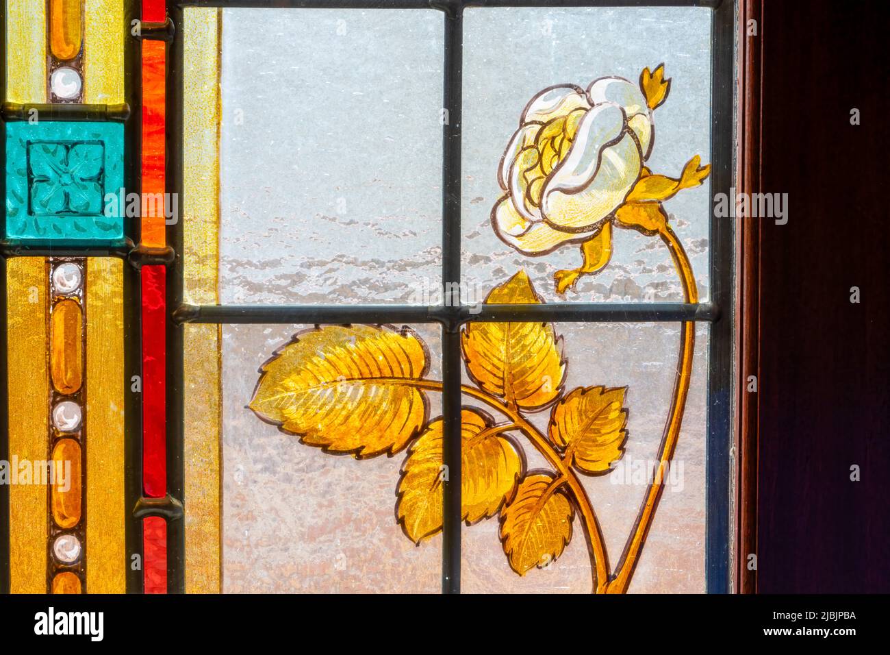 An ornate stained glass window within the auditorium on the Grand