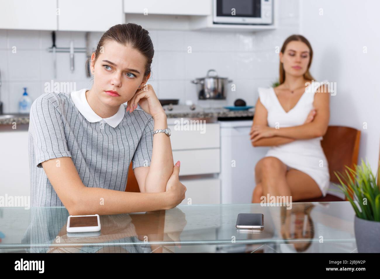 Two upset girls after quarrel Stock Photo