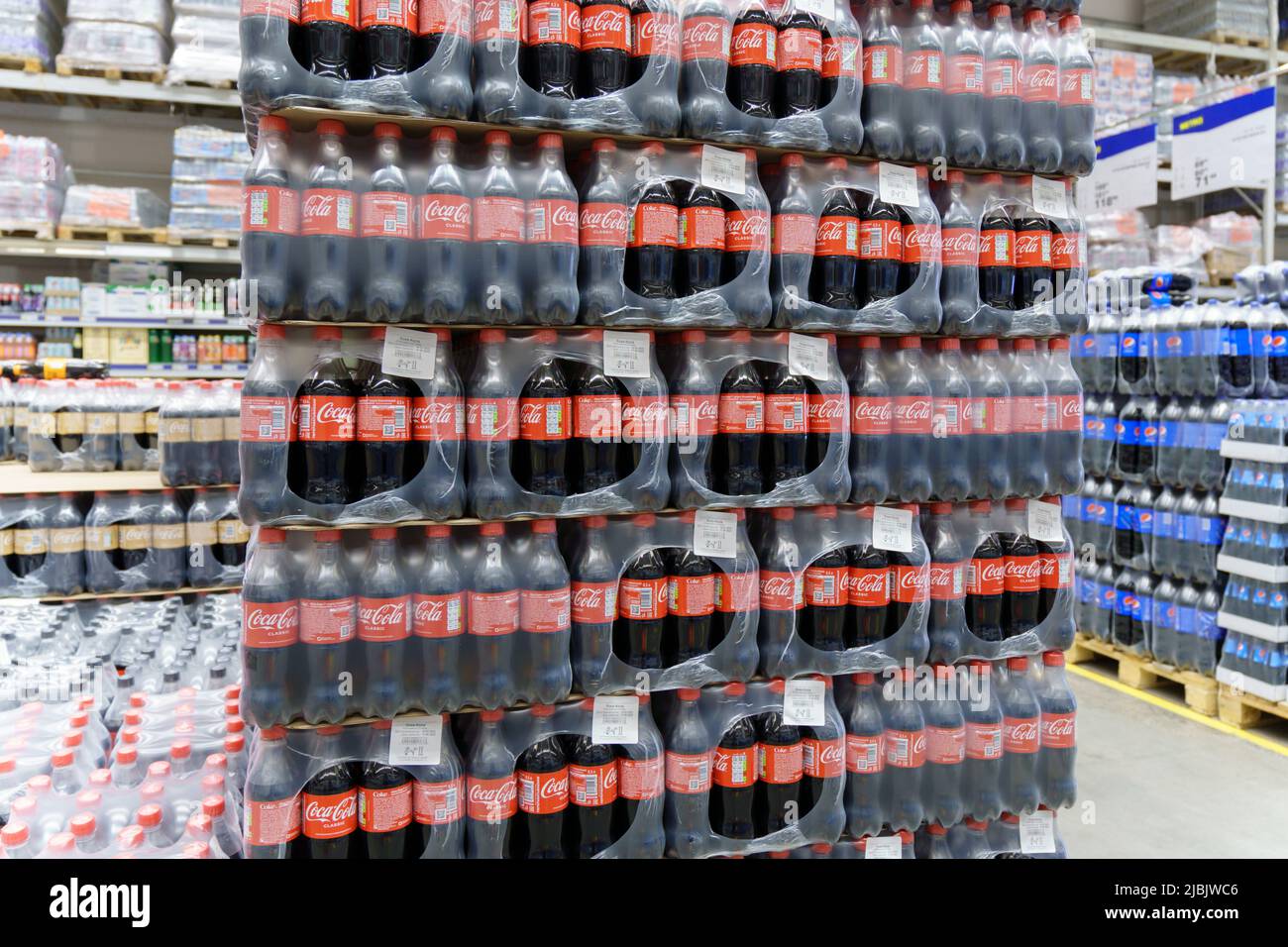 Tyumen, Russia-May 11, 2022: Coca Cola brand soft drink on display for sell at a supermarket. Coca Cola is a famous soft drink maker. Stock Photo