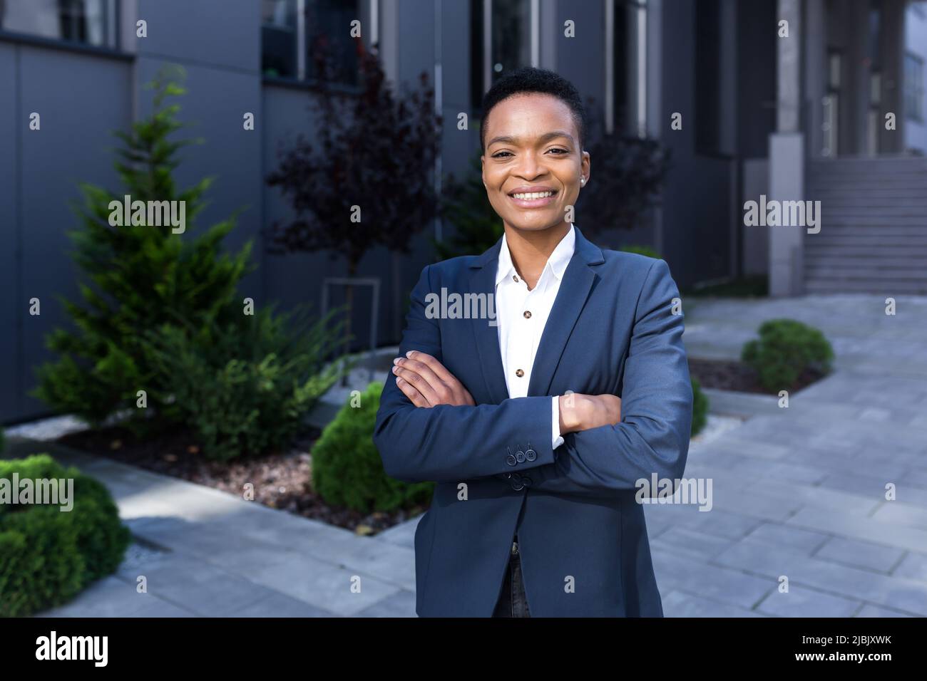 Portrait of young successful african american business woman happy and ...