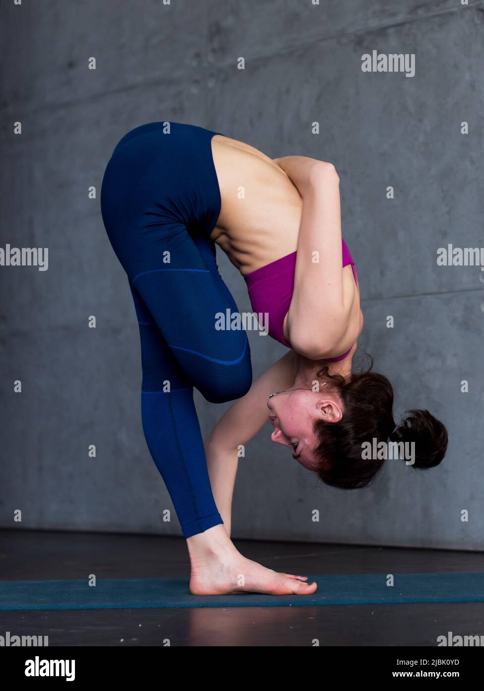 Half bound lotus standing forward bend hires stock photography and images Alamy